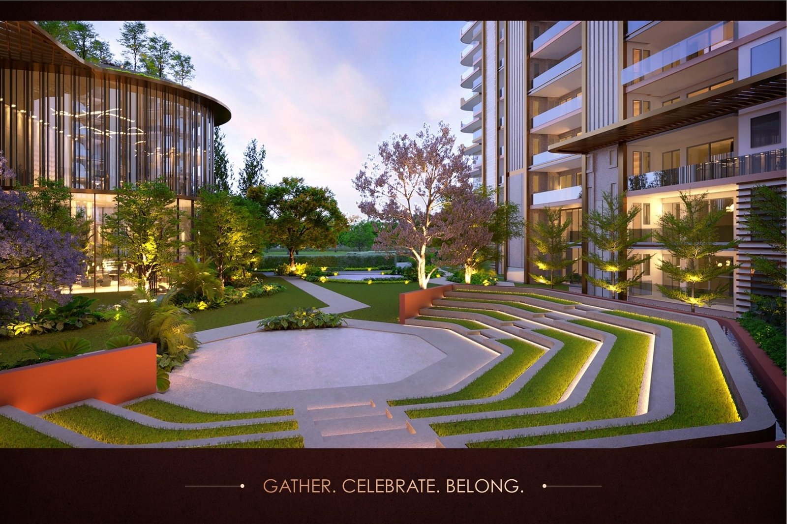 Wide view of a modern courtyard between a curved glass-walled building on the left and a multi‑story residential block on the right, with terraced lawns, winding concrete steps, trees, and warm ground lighting at dusk; bottom shows the tagline 'GATHER. CELEBRATE. BELONG.'
