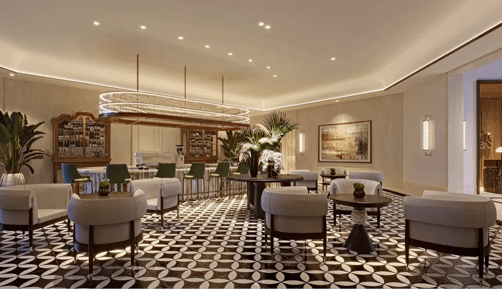 Luxe hotel lobby lounge with circular ceiling lights, bar area, and plush gray seating on a black-and-white geometric tile floor.